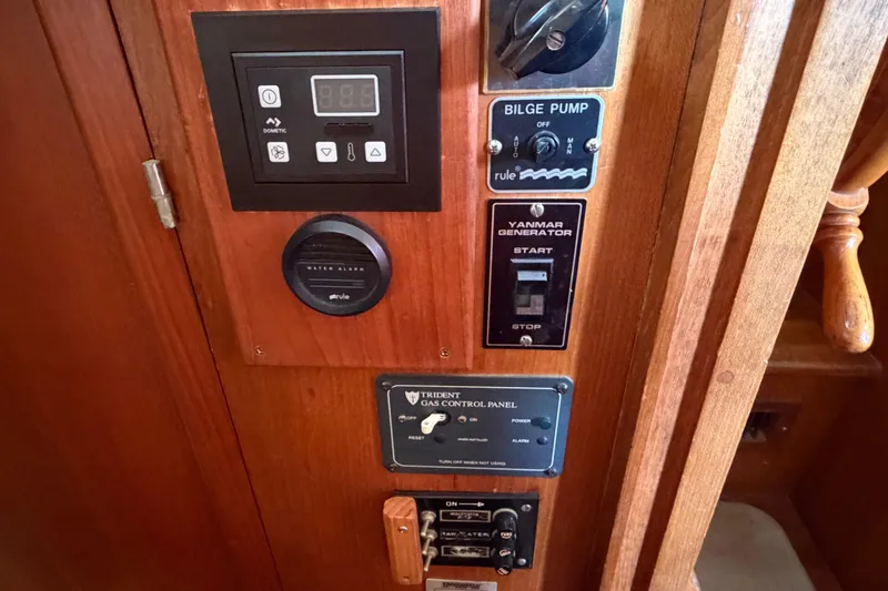 Slide: The Image of Control panel of a 1985 Albin 36 Trawler with bilge pump and generator switches. - 41