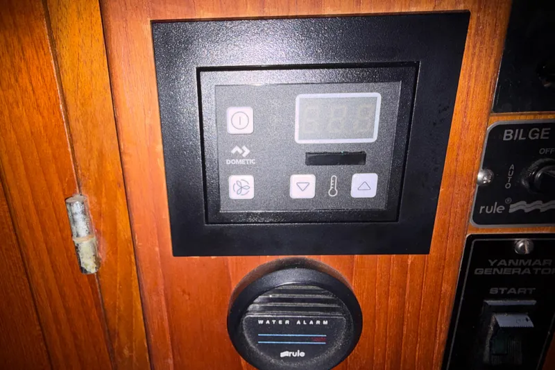Slide: The Image of Control panel on 1985 Albin 36 Trawler with Dometic display and water alarm. - 42