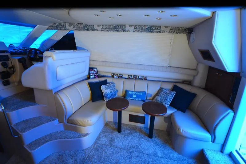 Slide: The Image of Luxurious interior of 1999 Cruisers Yachts 3585 Flybridge with plush seating and elegant decor. - 14