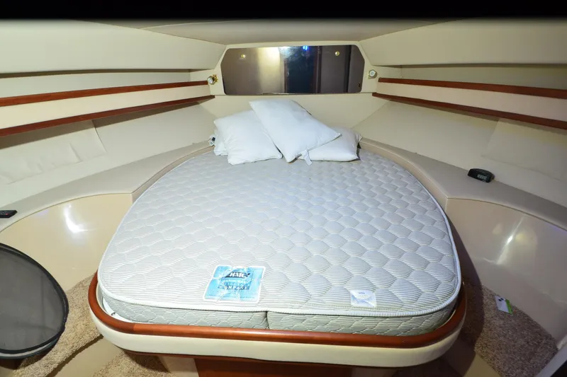 Slide: The Image of 1999 Cruisers Yachts 3585 Flybridge helm with steering wheel and instrument panel. - 19