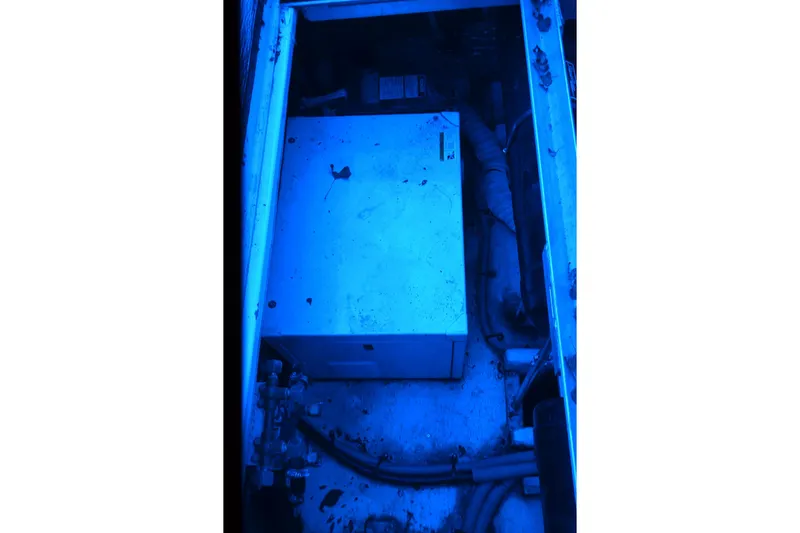 Slide: The Image of Engine compartment of a 1999 Cruisers Yachts 3585 Flybridge, illuminated in blue light. - 27
