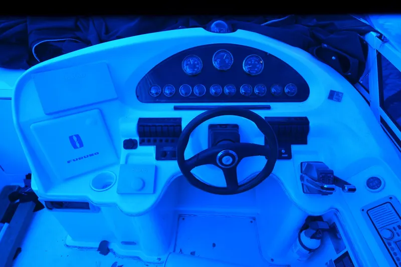 Slide: The Image of 1999 Cruisers Yachts 3585 Flybridge helm with steering wheel and instrument panel. - 28