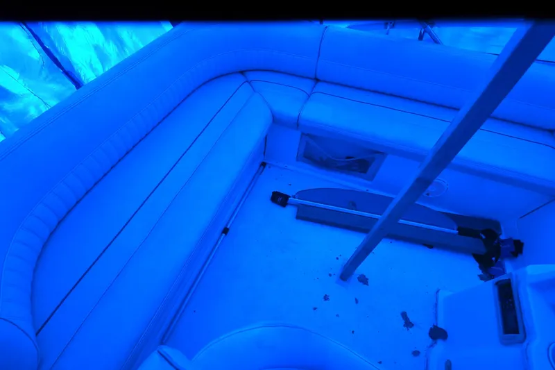 Slide: The Image of Interior of 1999 Cruisers Yachts 3585 Flybridge with blue lighting and seating area. - 32