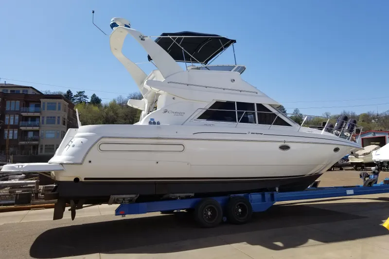 Slide: The Image of 1999 Cruisers Yachts 3585 Flybridge on trailer, side view, sunny day. - 36