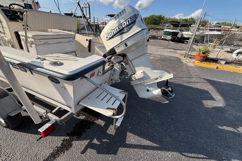 Slide: The Image of 2000 Key West 1720 Center Console boat with Johnson outboard motor on trailer. - 18