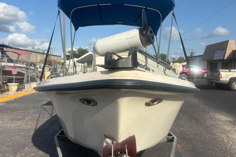 Slide: The Image of 2000 Key West 1720 Center Console boat with Johnson outboard motor on trailer. - 2