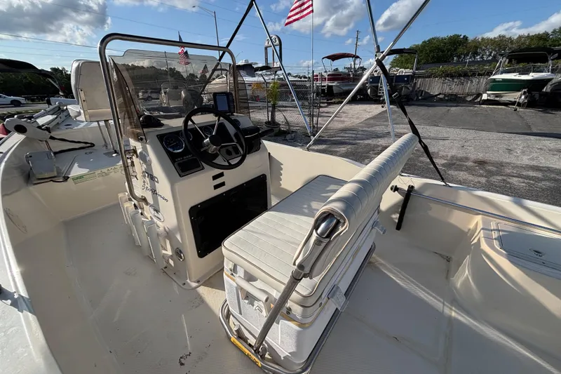 Slide: The Image of 2000 Key West 1720 Center Console boat interior with steering wheel and seating. - 20