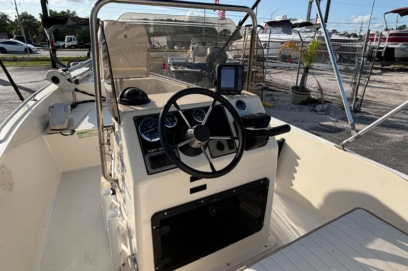 Slide: The Image of 2000 Key West 1720 Center Console boat interior with steering wheel and gauges. - 21