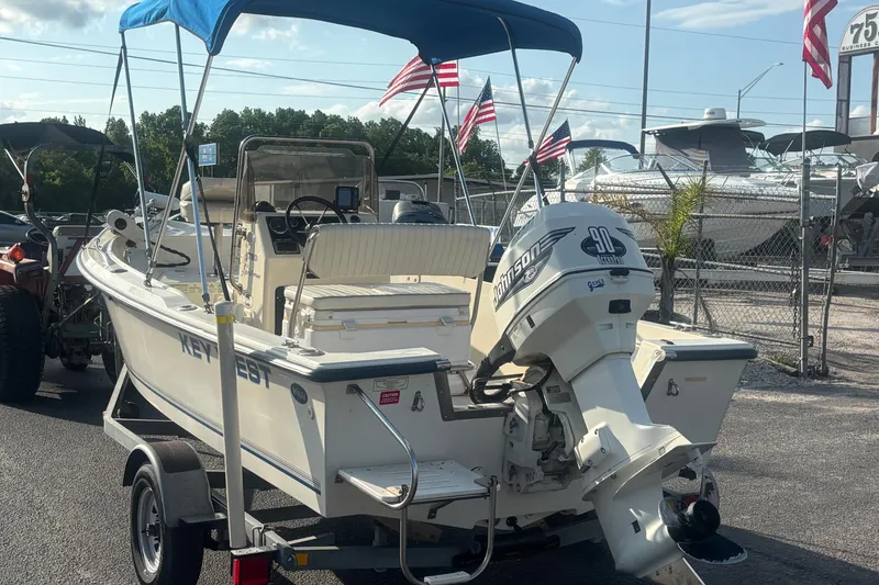 Slide: The Image of 2000 Key West 1720 Center Console boat with Johnson 90 HP engine on trailer. - 5