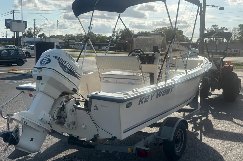 Slide: The Image of 2000 Key West 1720 Center Console boat with Johnson outboard motor on trailer. - 7
