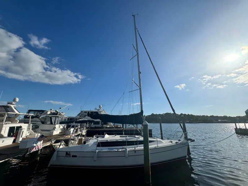 The Image of 2017 Marlow-Hunter 31 sailboat docked in sunny marina. - 1