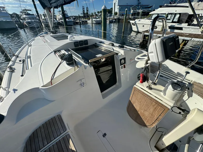 Slide: The Image of 2017 Marlow-Hunter 31 sailboat cockpit with marina view. - 5