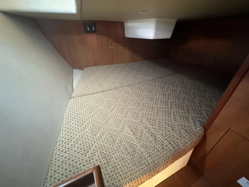 Slide: The Image of 2017 Marlow-Hunter 31 yacht interior cabin with cushioned bed. - 9