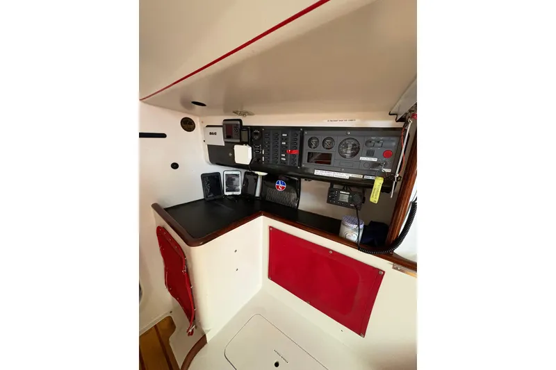 Slide: The Image of Control panel of a 1999 Laurie Davidson TP-52 yacht, featuring navigation instruments. - 6