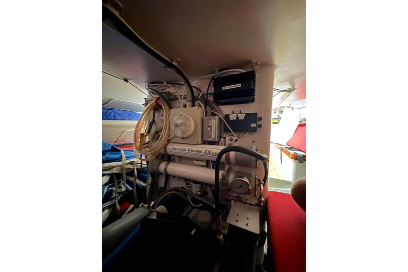 Slide: The Image of Interior of 1999 Laurie Davidson TP-52 yacht, showcasing mechanical equipment and wiring. - 8