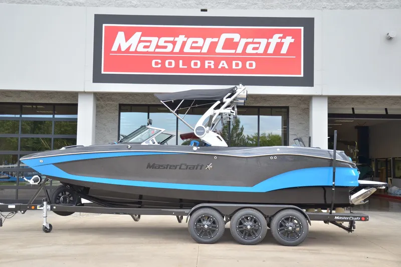 The Image of 2020 MasterCraft X24 boat on trailer at MasterCraft Colorado dealership. - 1