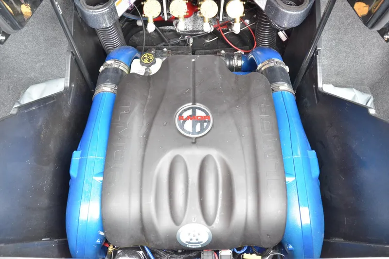 Slide: The Image of Engine compartment of a 2020 MasterCraft X24 boat with Ilmor branding. - 12