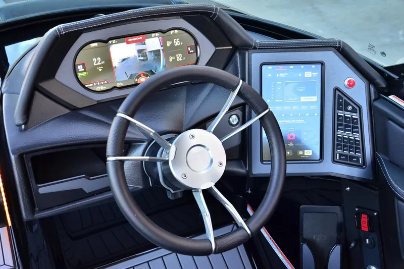 Slide: The Image of 2024 MasterCraft XStar S dashboard with advanced digital displays and steering wheel. - 10