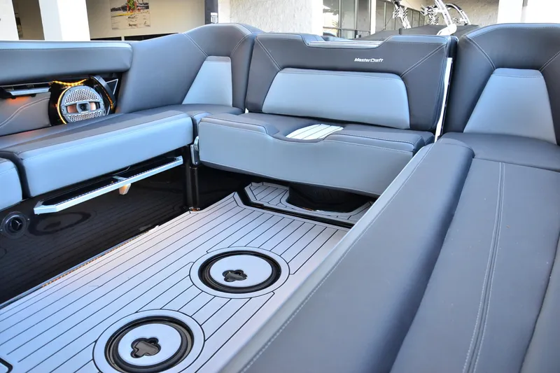 Slide: The Image of 2024 MasterCraft XStar S interior with sleek seating and modern design elements. - 12