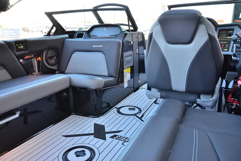 Slide: The Image of 2024 MasterCraft XStar S interior with sleek seating and modern dashboard design. - 14