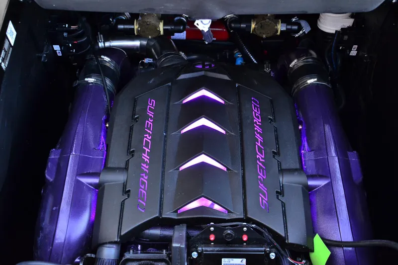 Slide: The Image of 2024 MasterCraft XStar S supercharged engine with purple accents and sleek design. - 16