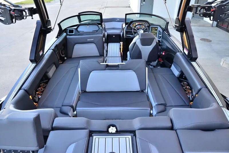 Slide: The Image of 2024 MasterCraft XStar S interior with luxurious seating and modern dashboard design. - 18