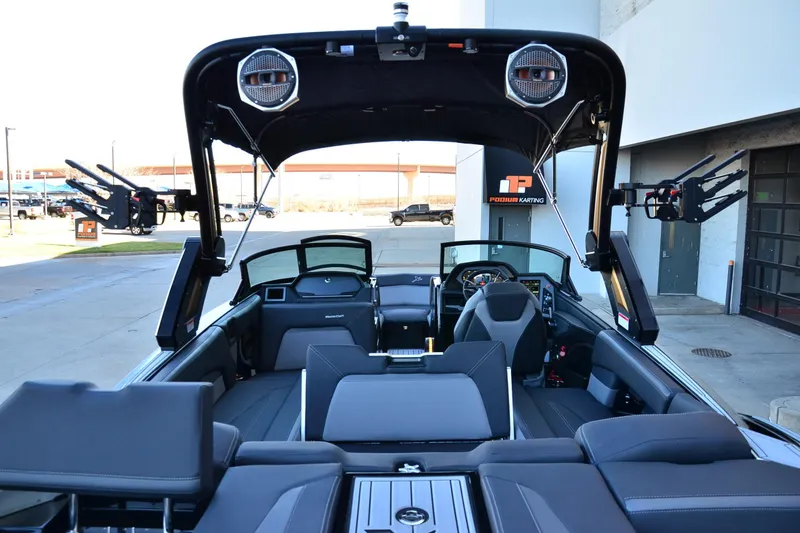 Slide: The Image of 2024 MasterCraft XStar S boat interior with sleek seating and advanced dashboard features. - 19