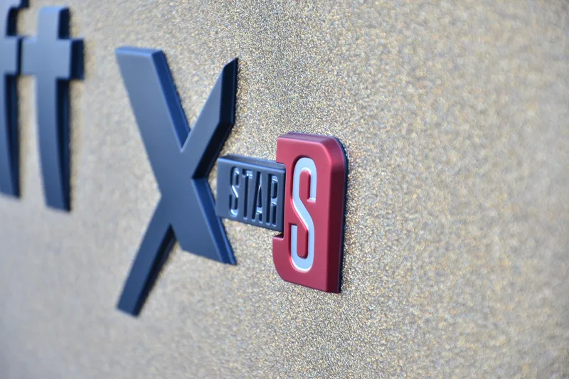 Slide: The Image of 2024 MasterCraft XStar S logo on textured surface. - 22