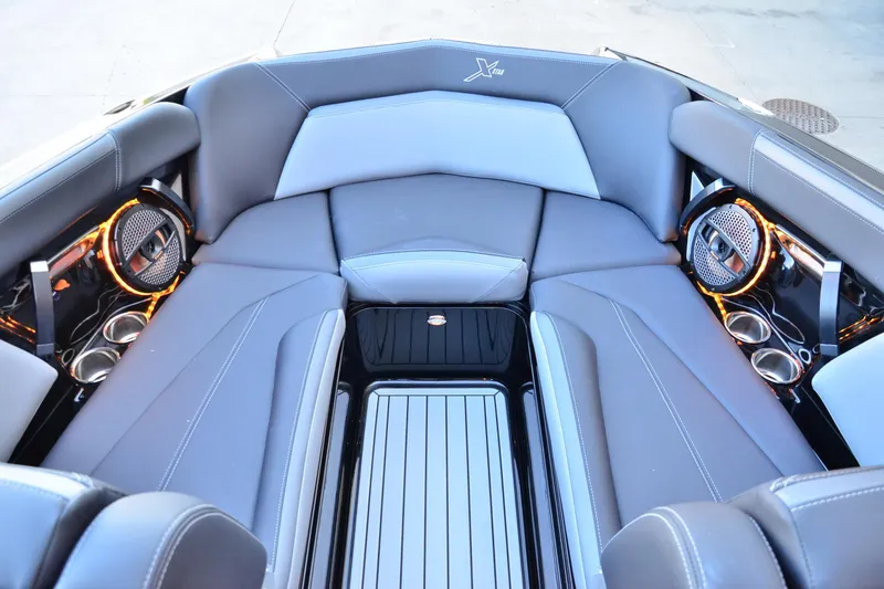 Slide: The Image of 2024 MasterCraft XStar S interior with sleek seating and premium audio system. - 7