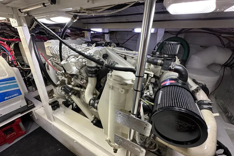 Slide: The Image of Engine room of a 1976 Pacifica Flybridge boat, showcasing detailed mechanical components. - 10