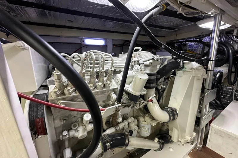 Slide: The Image of Engine room of a 1976 Pacifica Flybridge boat, showcasing detailed mechanical components. - 11