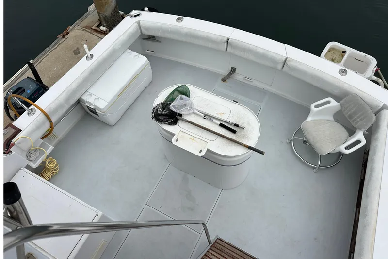 Slide: The Image of 1976 Pacifica Flybridge boat deck with fishing gear and seating arrangement. - 40