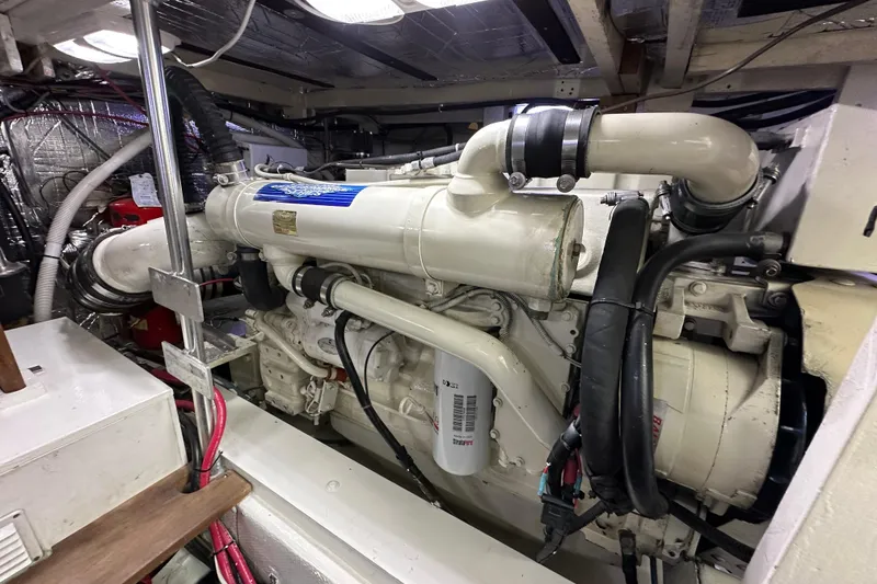 Slide: The Image of Engine room of a 1976 Pacifica Flybridge boat, showcasing a large marine engine. - 8