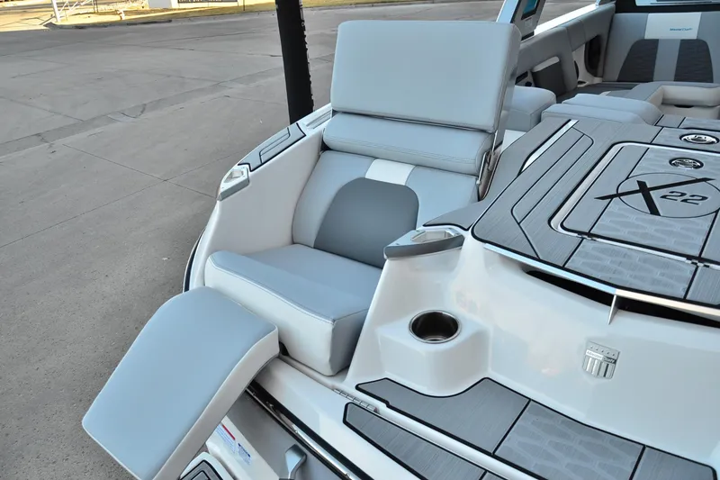 Slide: The Image of 2024 MasterCraft X22 boat interior with sleek seating and modern design. - 21
