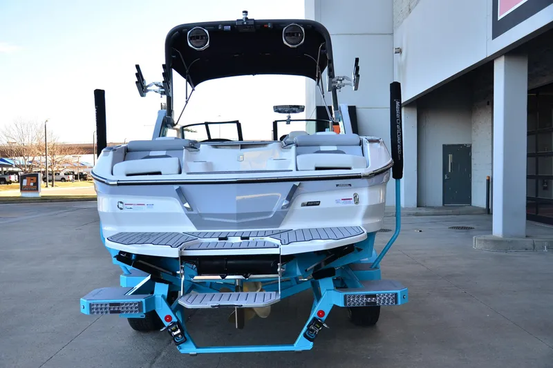 Slide: The Image of 2024 MasterCraft X22 boat rear view, showcasing sleek design and modern features. - 4