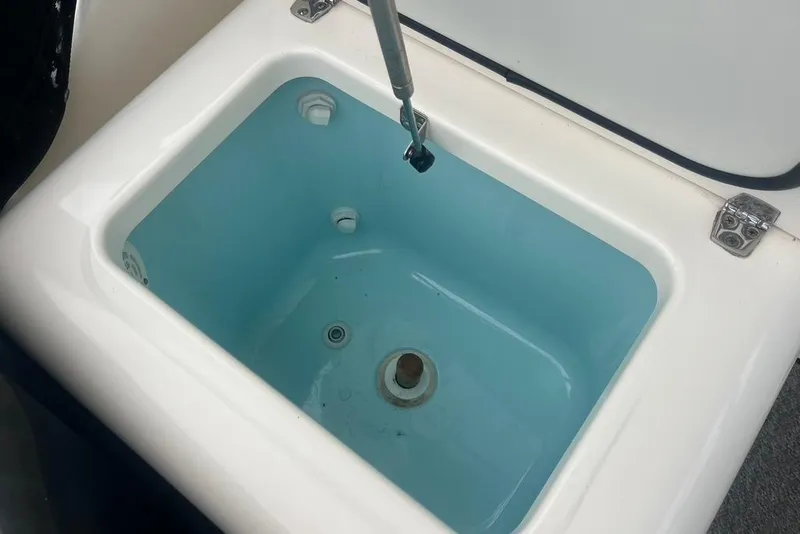 Slide: The Image of Livewell compartment in a 2005 Pursuit 3100 Offshore boat, open lid view. - 20