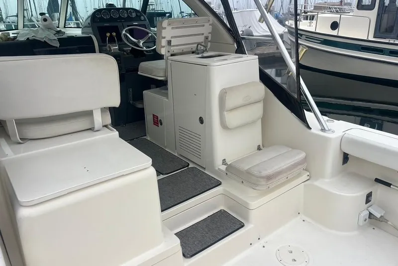 Slide: The Image of 2005 Pursuit 3100 Offshore boat interior with helm, seating, and dashboard. - 30