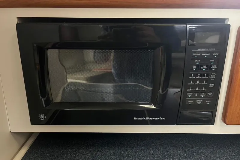 Slide: The Image of Built-in GE microwave oven on a 2005 Pursuit 3100 Offshore boat. - 33