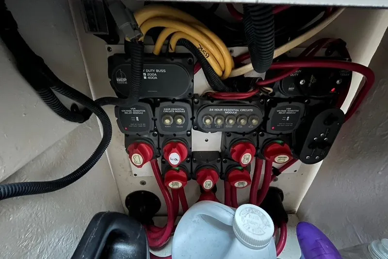Slide: The Image of Electrical panel of a 2005 Pursuit 3100 Offshore boat with wiring and circuit modules. - 39