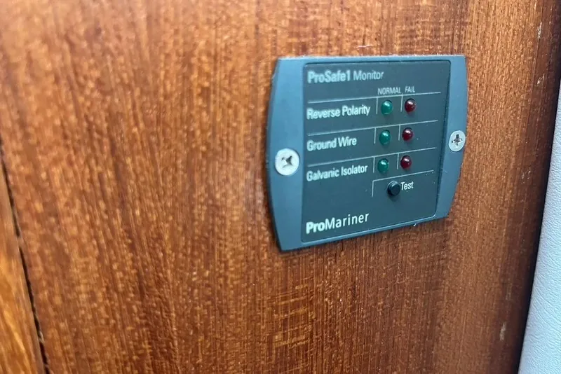 Slide: The Image of ProMariner ProSafe1 monitor on 2005 Pursuit 3100 Offshore boat, showing electrical indicators. - 42