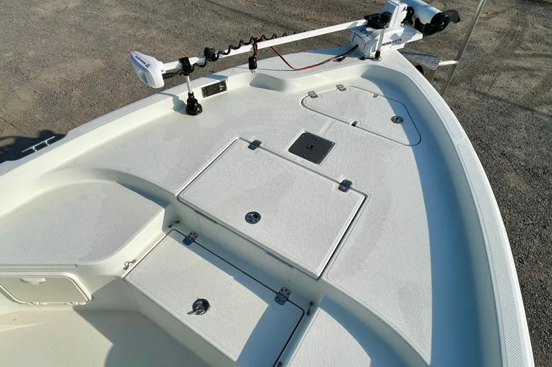 Slide: The Image of 2005 Sailfish 1900 BB Bay Boat deck with storage compartments and trolling motor. - 11