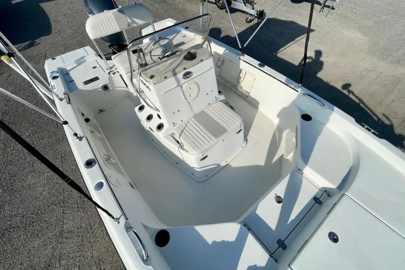 Slide: The Image of 2005 Sailfish 1900 BB Bay Boat interior with console and seating, viewed from above. - 12