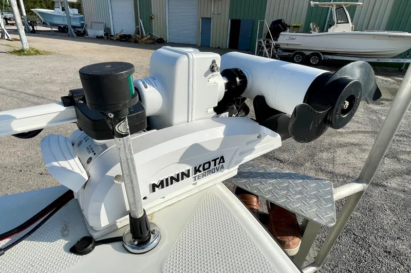 Slide: The Image of Minn Kota Terrova trolling motor on 2005 Sailfish 1900 BB Bay Boat, docked outdoors. - 14