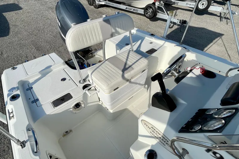 Slide: The Image of 2005 Sailfish 1900 BB Bay Boat interior with seating and control panel. - 17