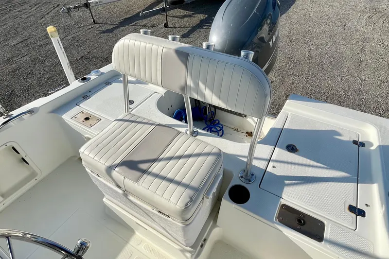 Slide: The Image of 2005 Sailfish 1900 BB Bay Boat interior with seating and storage compartments. - 18