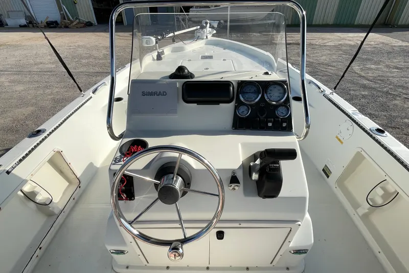 Slide: The Image of 2005 Sailfish 1900 BB Bay Boat dashboard with steering wheel and controls. - 20