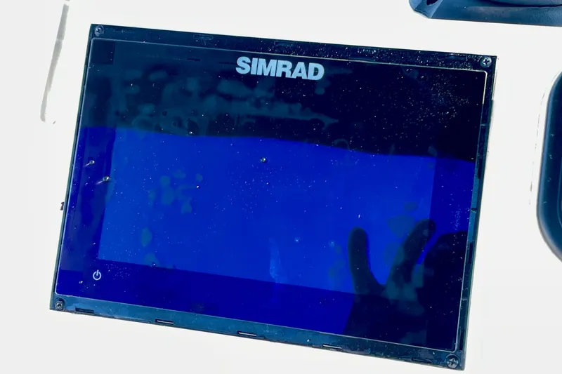 Slide: The Image of Simrad marine display on 2005 Sailfish 1900 BB Bay Boat dashboard. - 23
