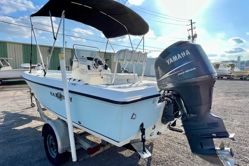 Slide: The Image of 2005 Sailfish 1900 BB Bay Boat with Yamaha outboard motor, parked on a trailer. - 5