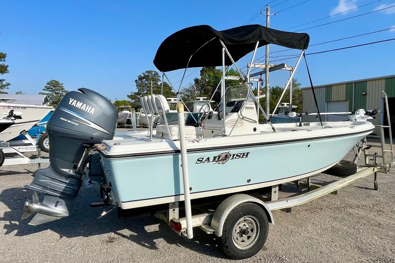 Slide: The Image of 2005 Sailfish 1900 BB Bay Boat with Yamaha engine on trailer, outdoor setting. - 8
