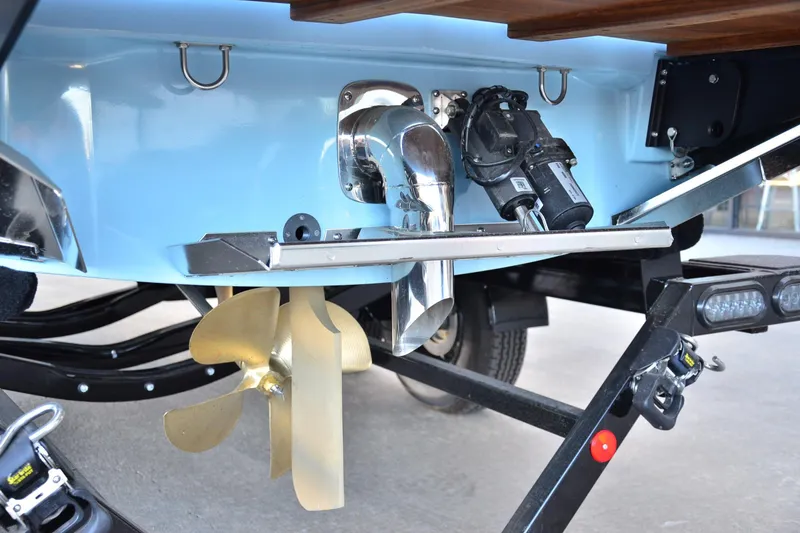 Slide: The Image of 2024 MasterCraft XT22 T boat propeller and exhaust system close-up. - 12
